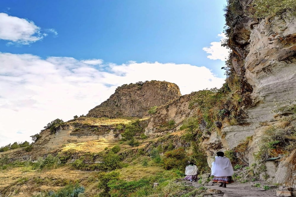 Lalibela Abune Yosef trek in Ethiopian Highlands Hiking Abune Yosef mountain near Lalibela Ethiopia Lalibela rock-hewn churches Ethiopia trekking tour Gelada baboons during Abune Yosef trek Ethiopia Traditional village on Lalibela Abune Yosef trek